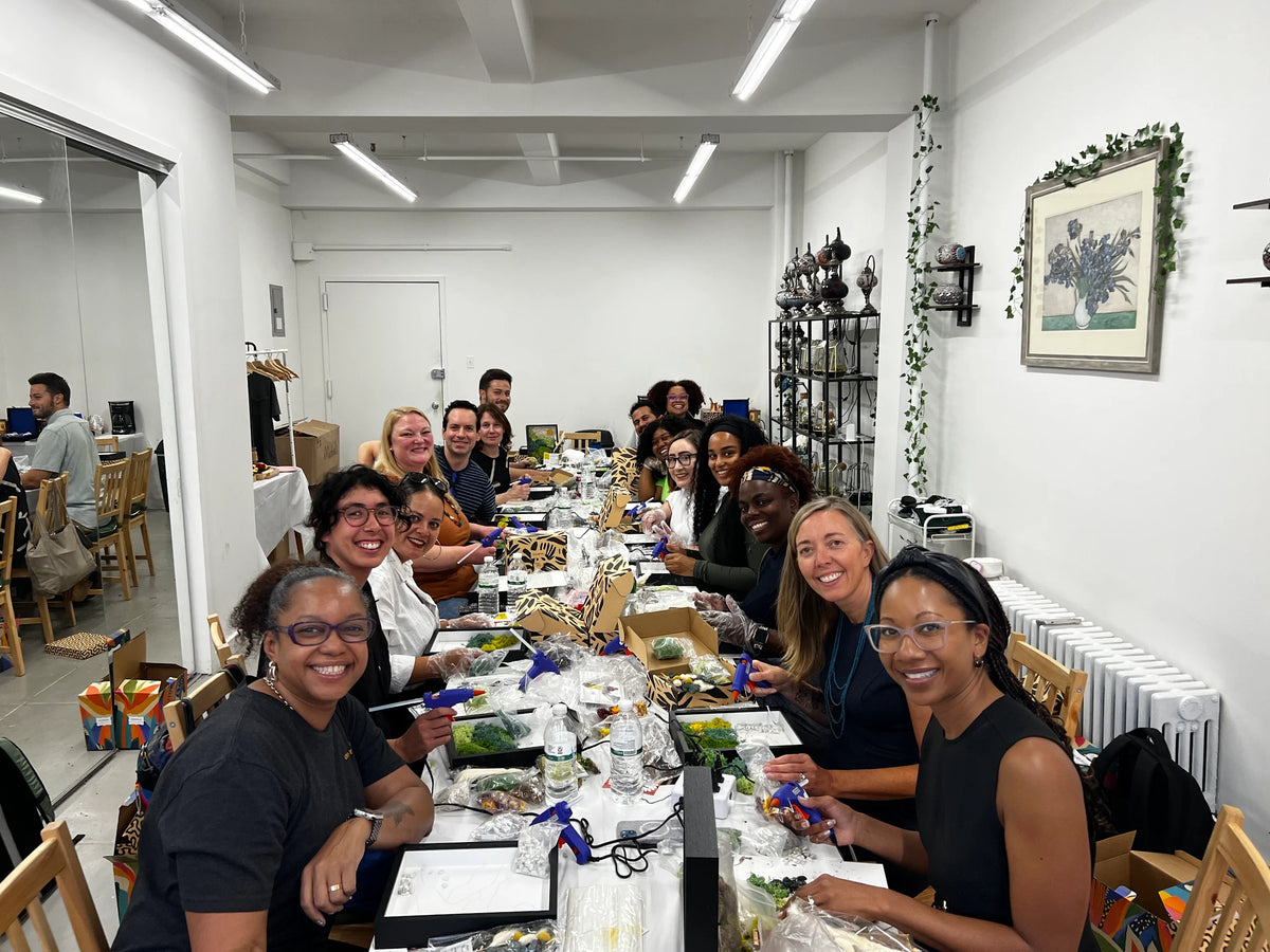 Group creating moss wall art at KraftStories Texas studio