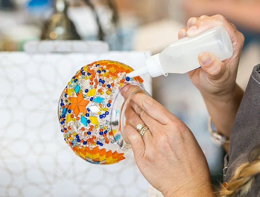 Colorful glass beads and tiles used for a Turkish mosaic lamp workshop in Austin, Texas