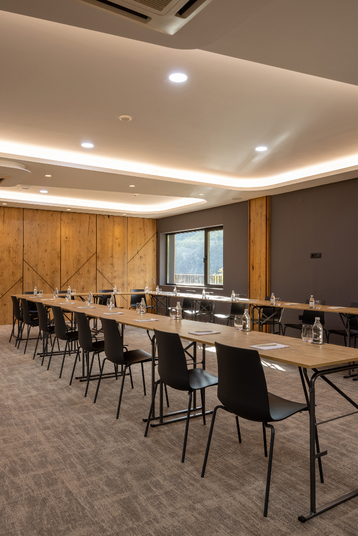 Long communal tables arranged for a collaborative onsite office workshop.