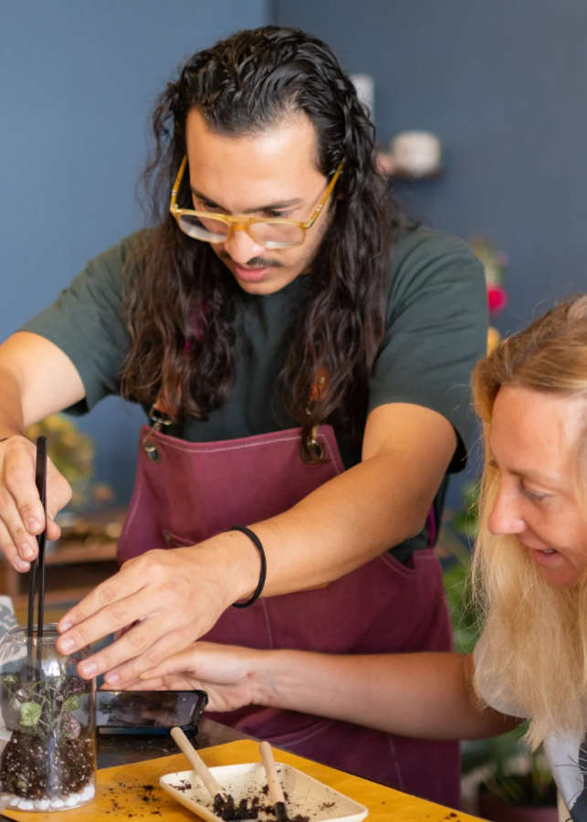 Participants building terrariums during a beginner-friendly DIY creative craft workshop at KraftStories.