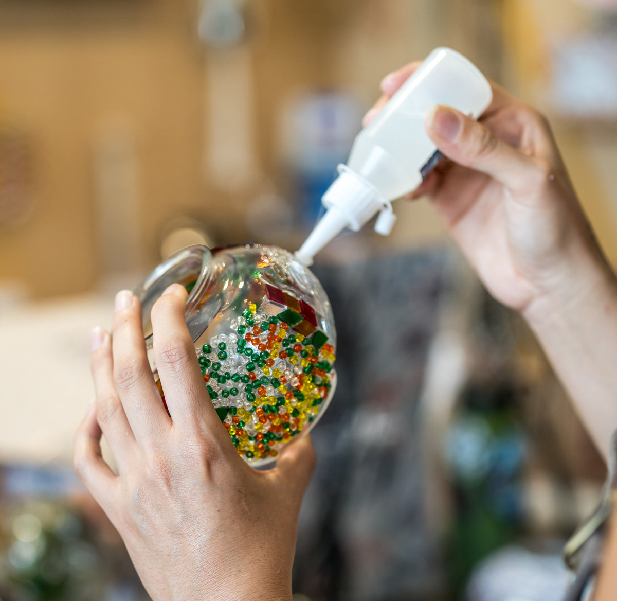 Colorful glass tiles and beads used for a Turkish mosaic lamp workshop in Austin, Texas