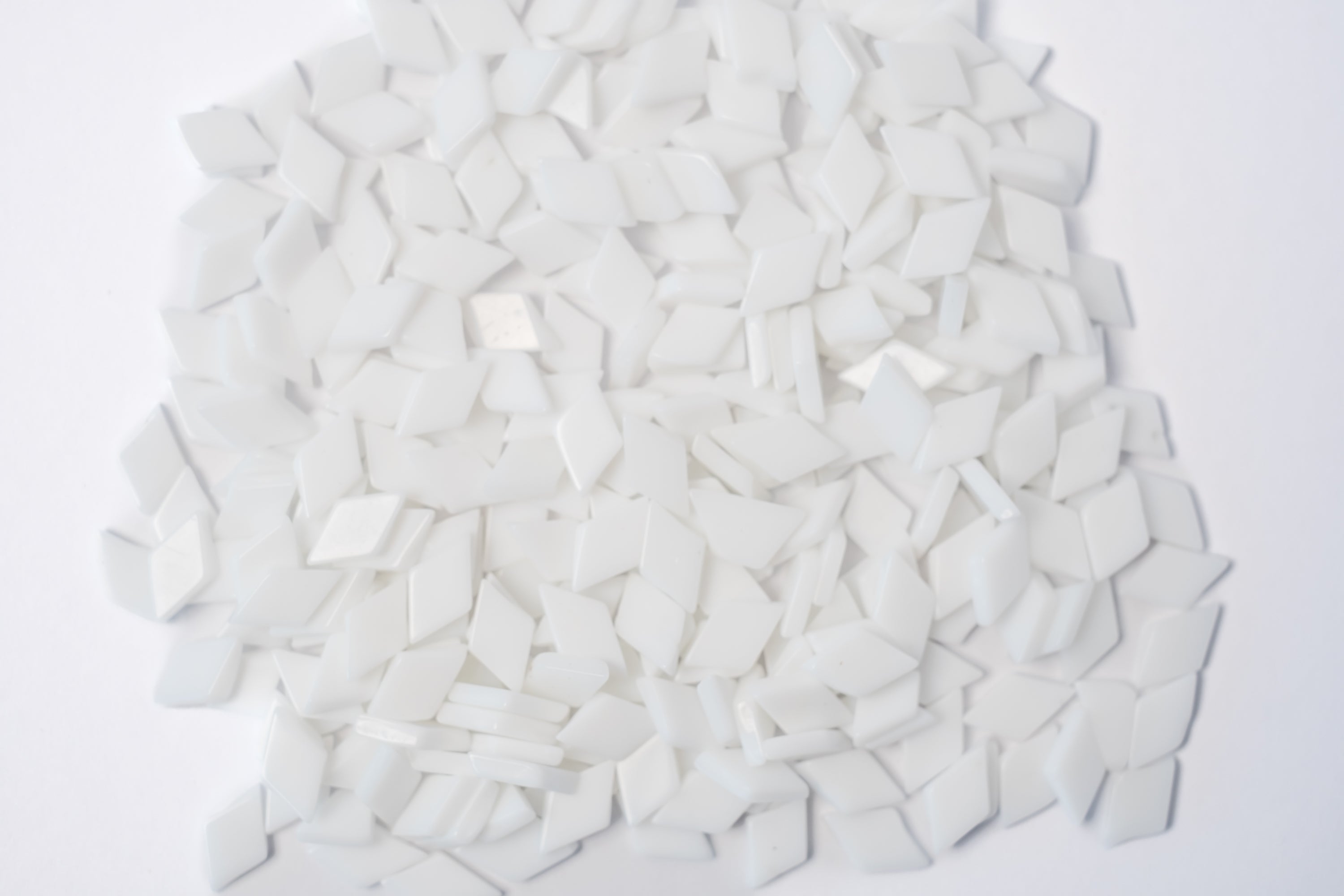 White glass mosaic tiles for crafts in diamond shape.