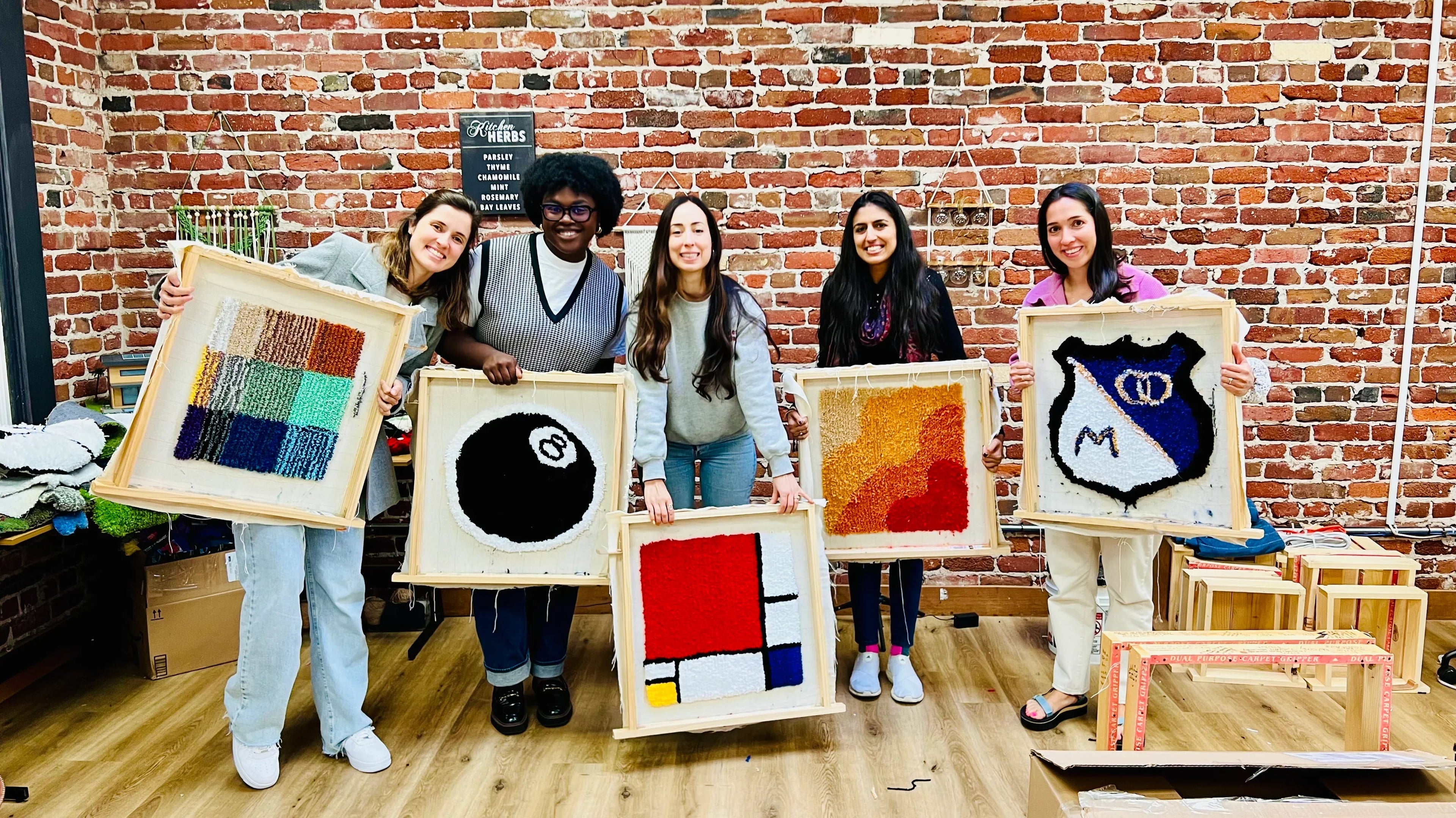 Guests making rugs at the KraftStories SoMa craft studio in San Francisco