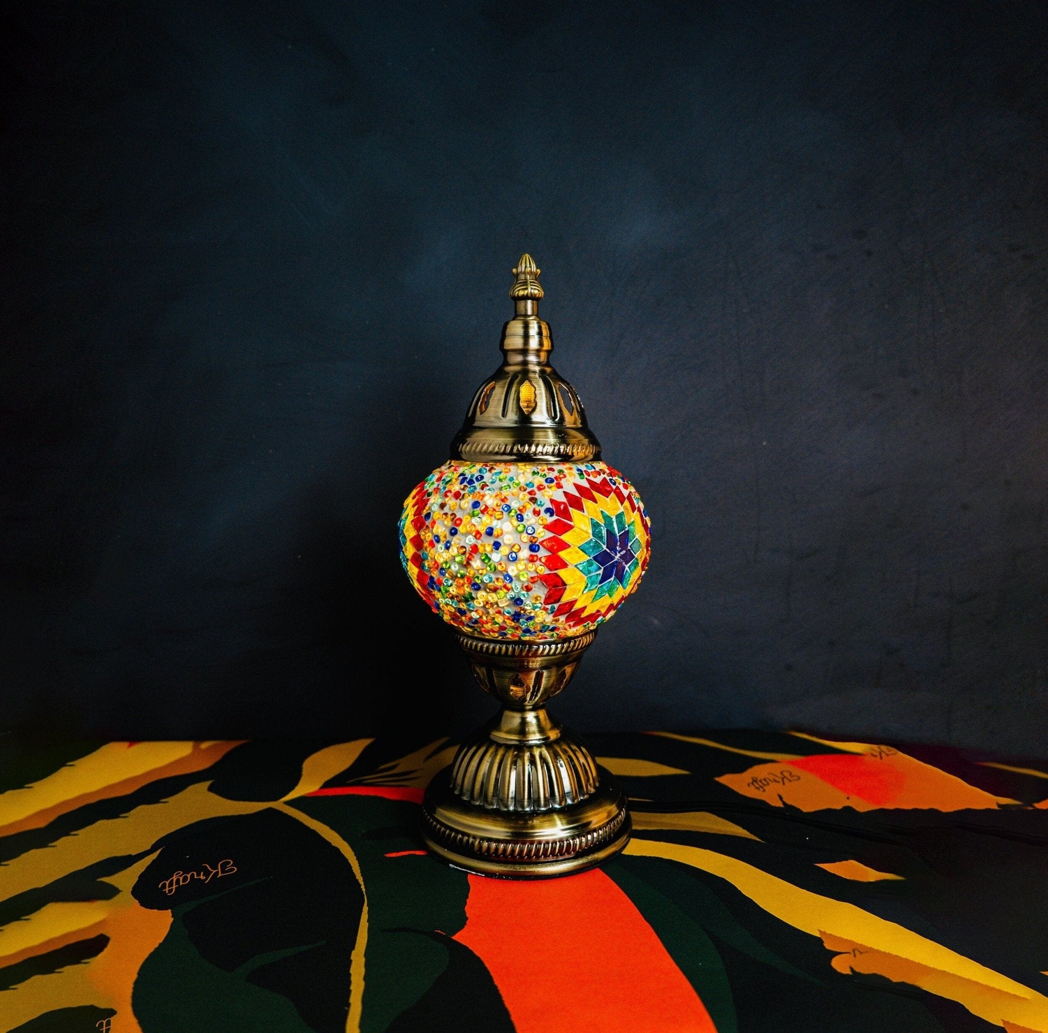 Vibrant Turkish mosaic lamp, showcasing intricate, colorful glass tiles in a classic design. This striking lighting piece evokes the rich cultural heritage and artistry of traditional Turkish craftsmanship.