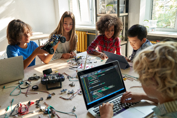 Students coding and building robots