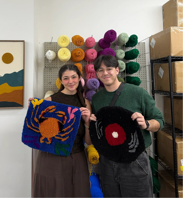 Rug tufting class in Texas - student using a tufting gun on a custom rug design