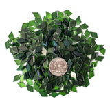 Assortment of dark green diamond-shaped glass mosaic tiles for crafts.