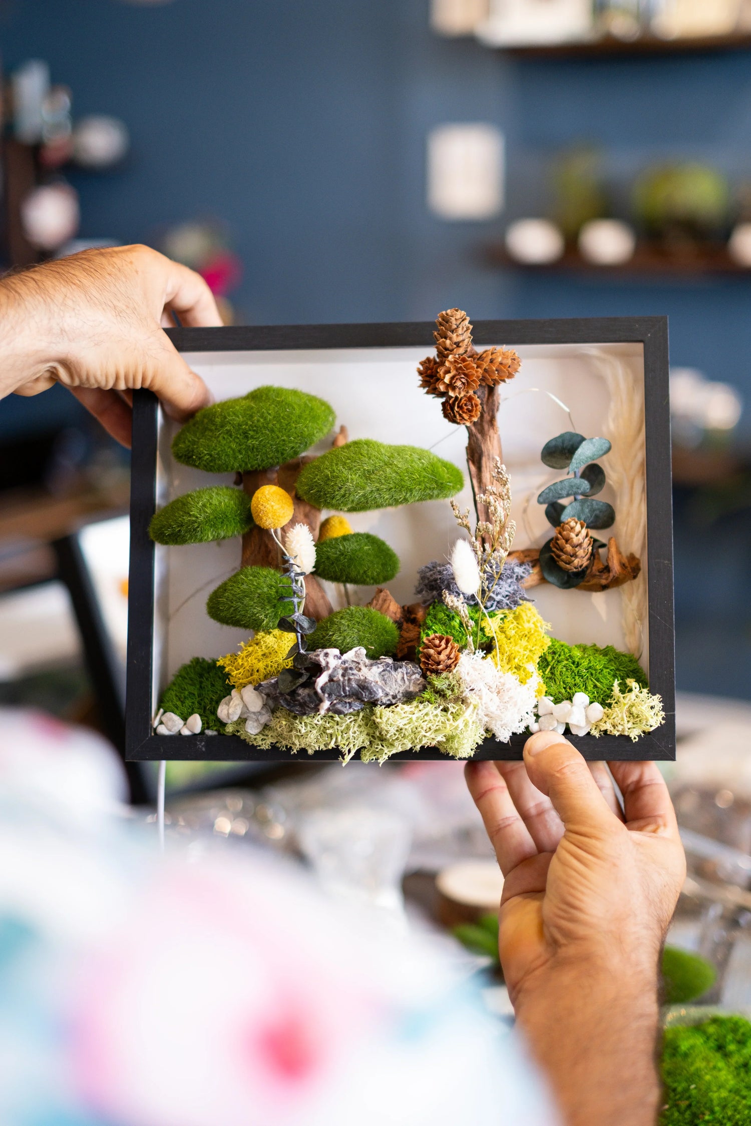 Finished preserved moss wall art piece made during an Austin, Texas workshop