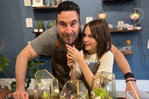 10 year old kid crafting with her dad at KraftStories studio in Honolulu Hawaii