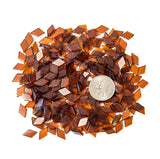 Light brown glass mosaic tiles in diamond shapes for crafts.