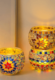 Handmade Turkish mosaic candle holders in vibrant colors and patterns, creating a warm and peaceful ambiance.