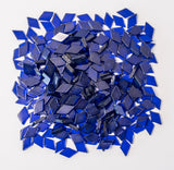 Decorative navy blue stained glass mosaic tiles in diamond shapes, perfect for craft projects such as lamps, frames, mirrors, and home decor.