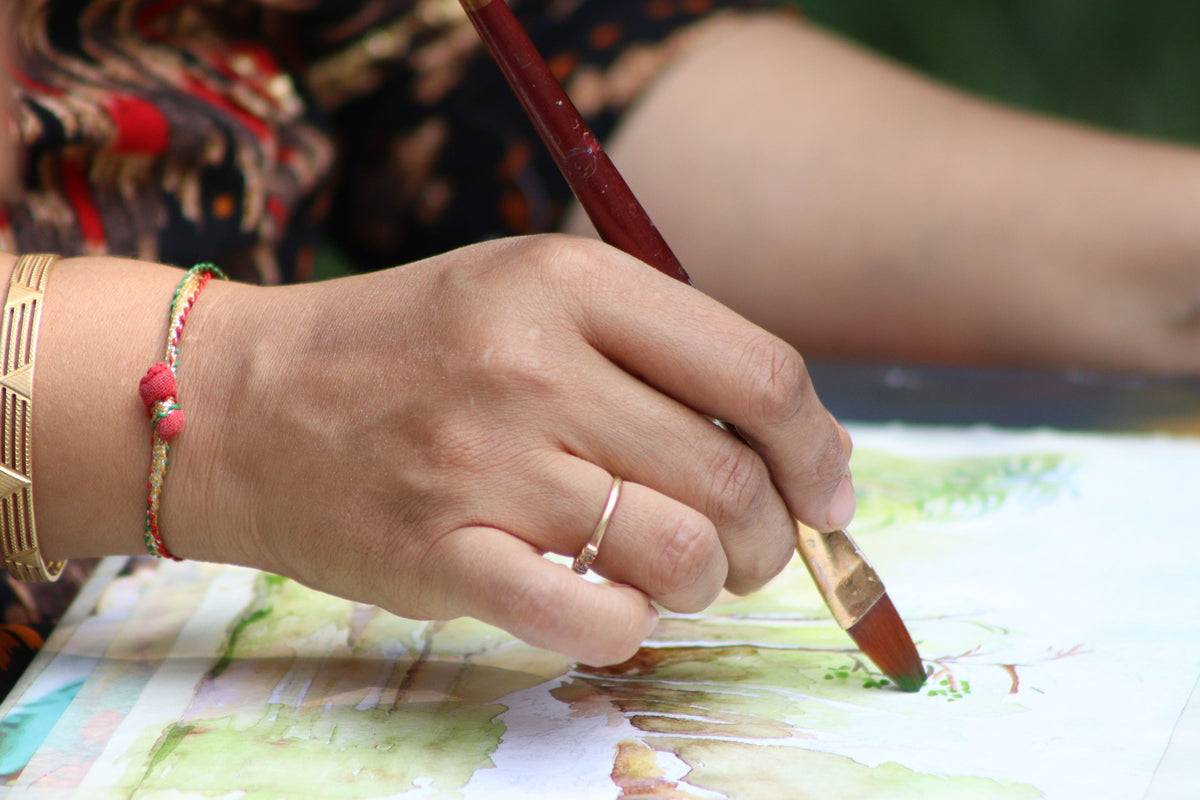 Close-up of a hand painting with watercolors - Watercolor Painting Workshop in NYC - KraftStories