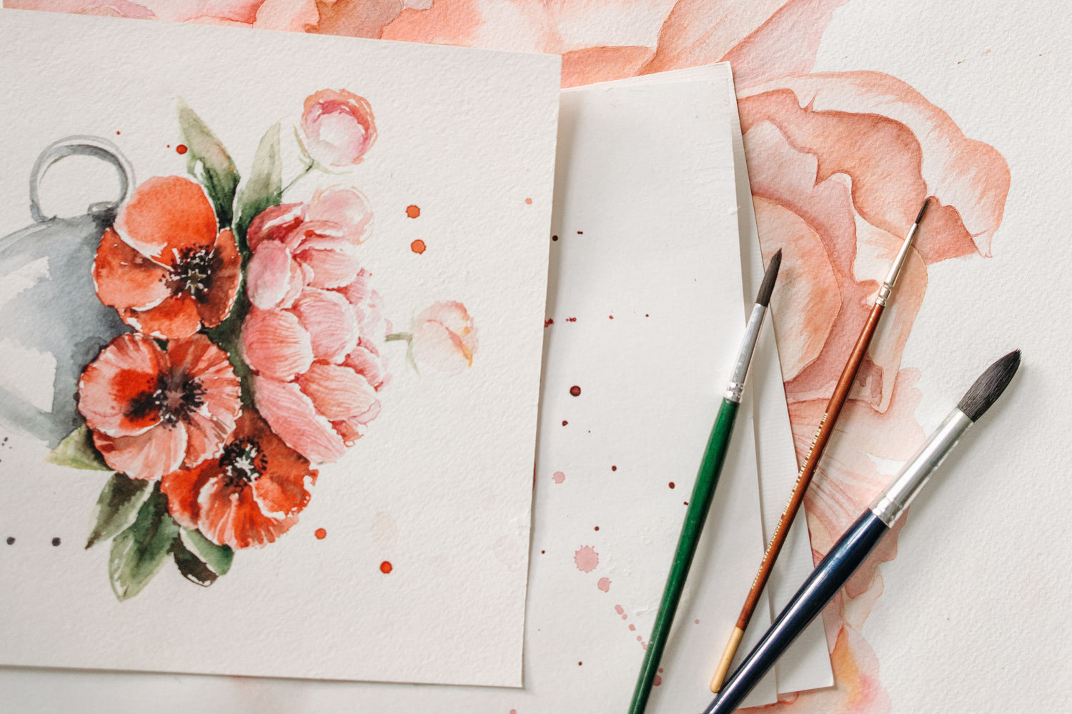 Finished watercolor flower paintings with brushes - Watercolor Painting Workshop in NYC - KraftStories