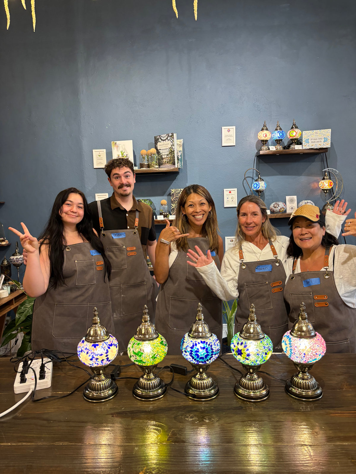 team building group participating in mosaic lamp workshop at KraftStories Hawaii, downtown Honolulu