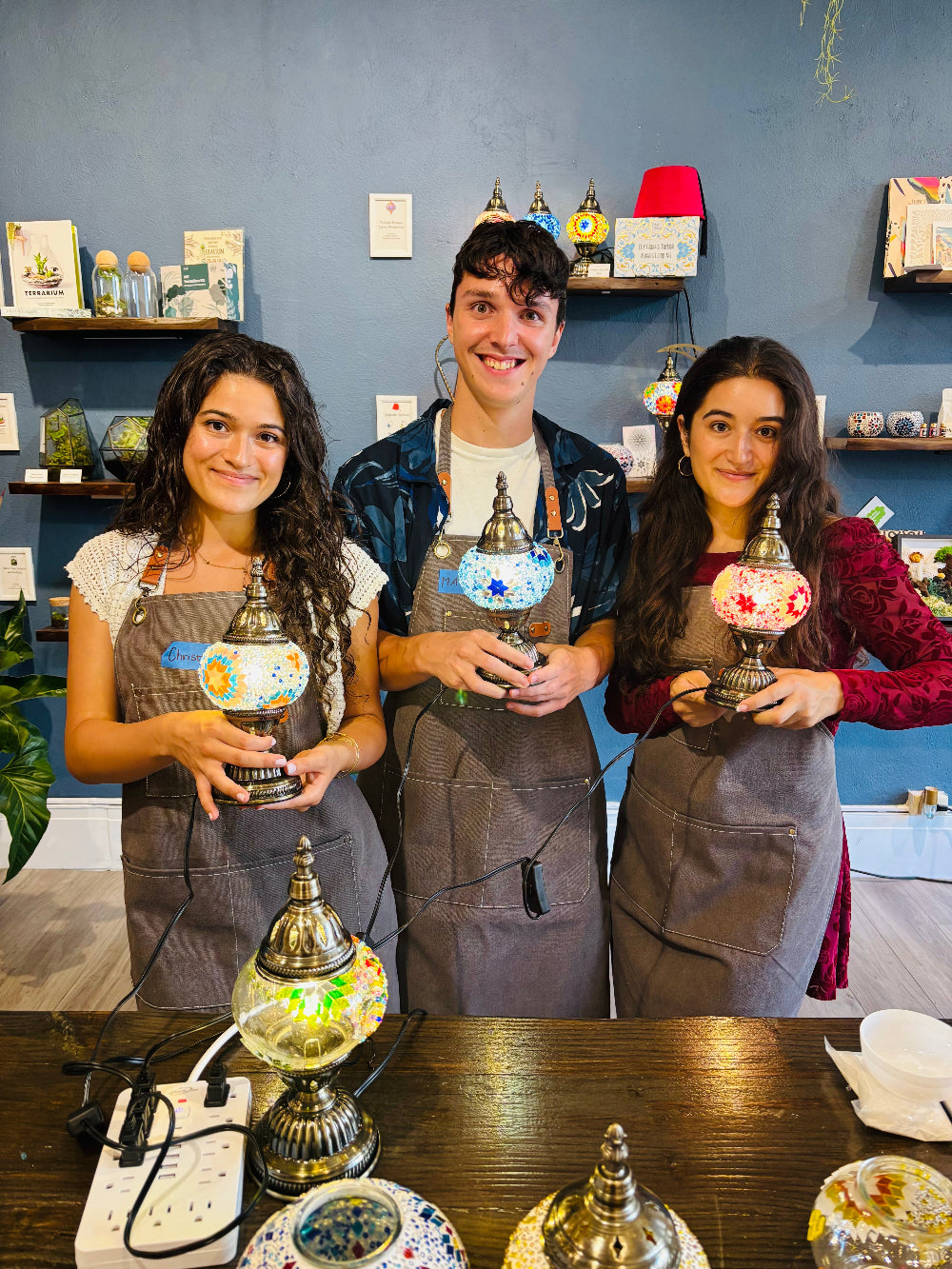 Teens crafting mosaic lamps at Krafstories studio in Honolulu Hawaii