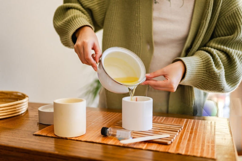 wax pouring into candle holder